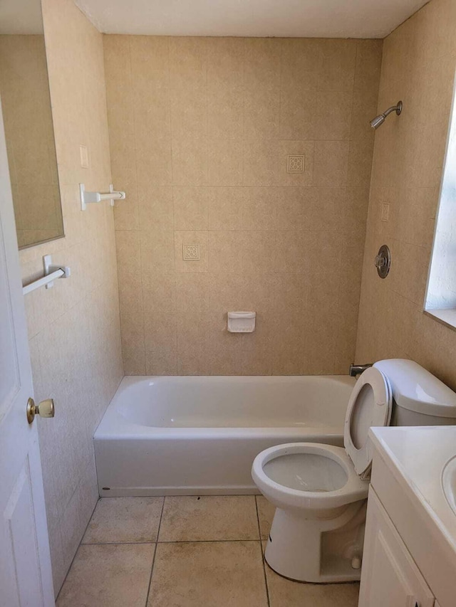 full bathroom with toilet, vanity, tile patterned floors, and tiled shower / bath