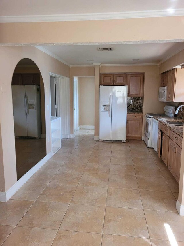 kitchen featuring white appliances, crown molding, sink, tasteful backsplash, and light tile patterned flooring