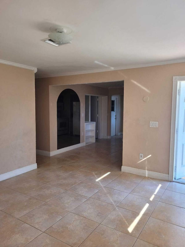 unfurnished room with ornamental molding