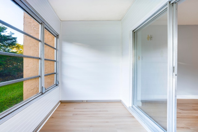 unfurnished sunroom featuring plenty of natural light