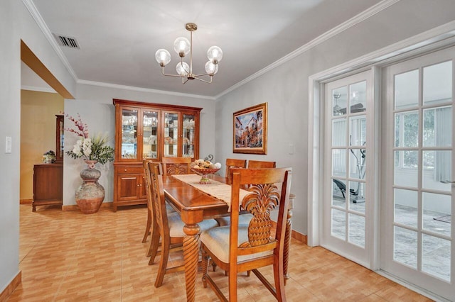 dining area featuring plenty of natural light, a chandelier, and ornamental molding