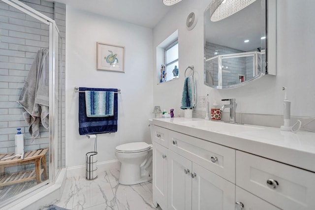 bathroom featuring walk in shower, vanity, and toilet