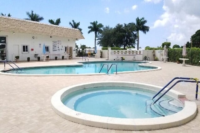 view of swimming pool with a patio