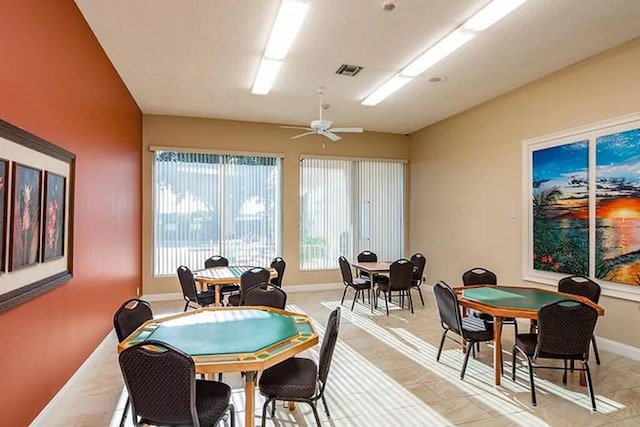 recreation room featuring ceiling fan and light tile patterned flooring