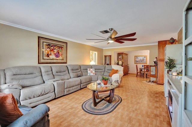 living room with ceiling fan and ornamental molding