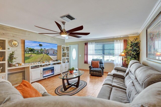 living room featuring crown molding, ceiling fan, and wood walls