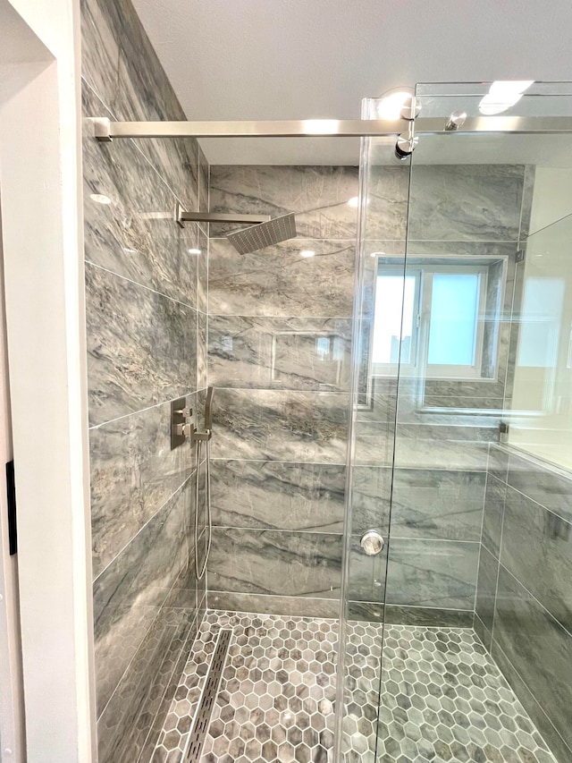 bathroom featuring an enclosed shower