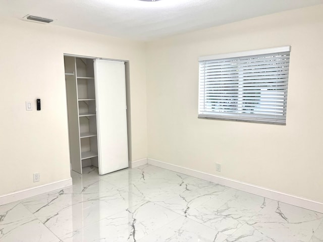 unfurnished bedroom featuring a closet