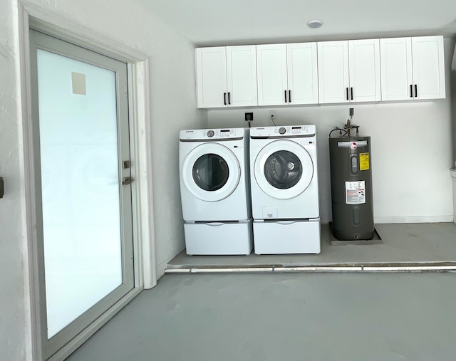 washroom with washer and dryer, cabinets, and water heater