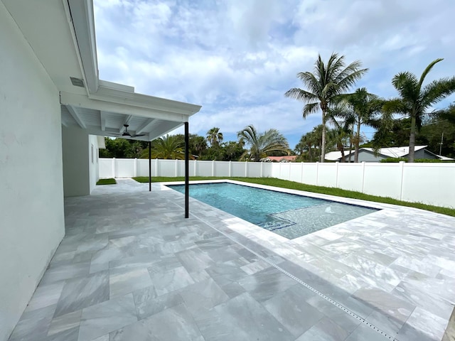 view of pool featuring a patio and ceiling fan