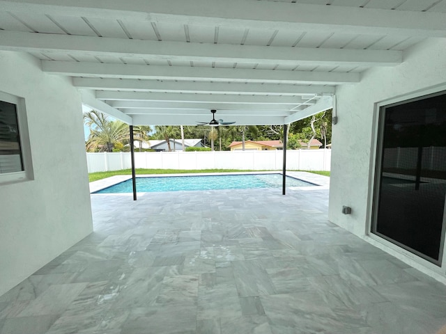 view of swimming pool with a patio area and ceiling fan