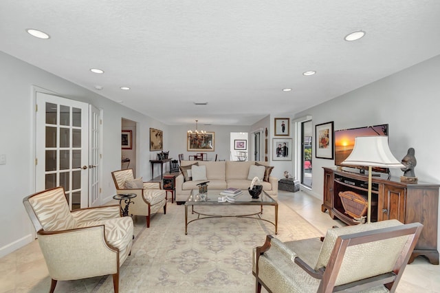 living room with a notable chandelier