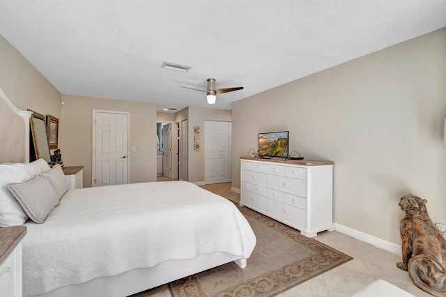 tiled bedroom featuring ceiling fan