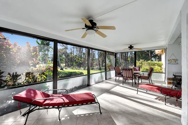 sunroom with ceiling fan and plenty of natural light