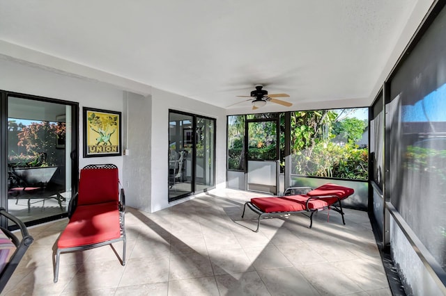 sunroom featuring ceiling fan