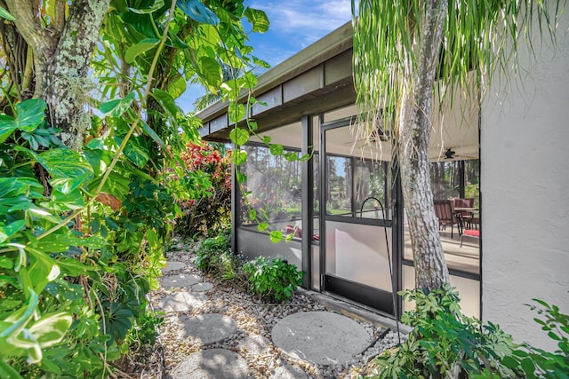 view of patio with a sunroom