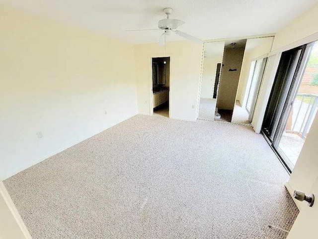 unfurnished room with light colored carpet and ceiling fan