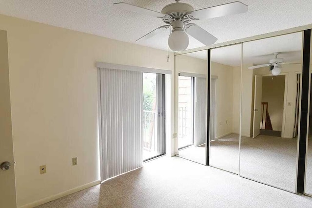 unfurnished bedroom featuring a textured ceiling, a closet, and ceiling fan