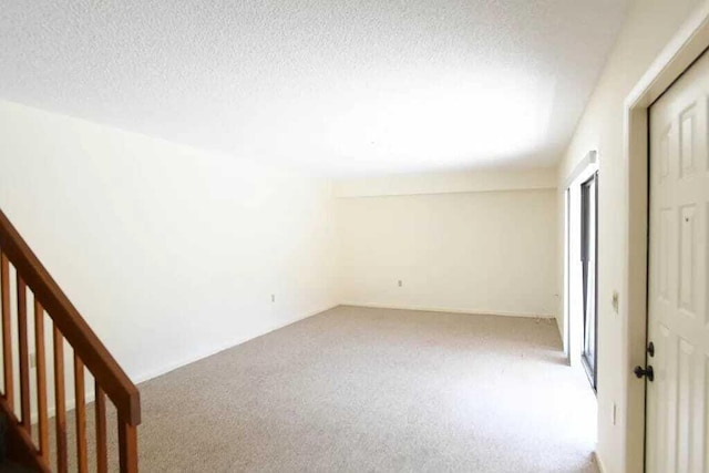 unfurnished bedroom featuring carpet floors and a textured ceiling