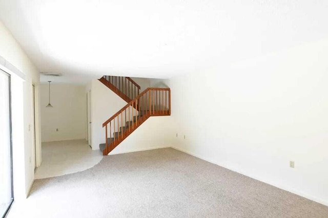 unfurnished living room with carpet floors