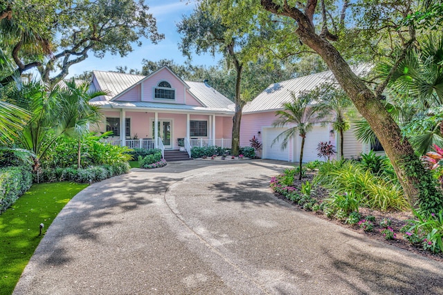 view of front of home featuring a porch and a garage