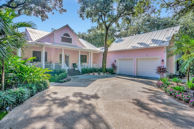 view of front of property featuring a porch and a garage