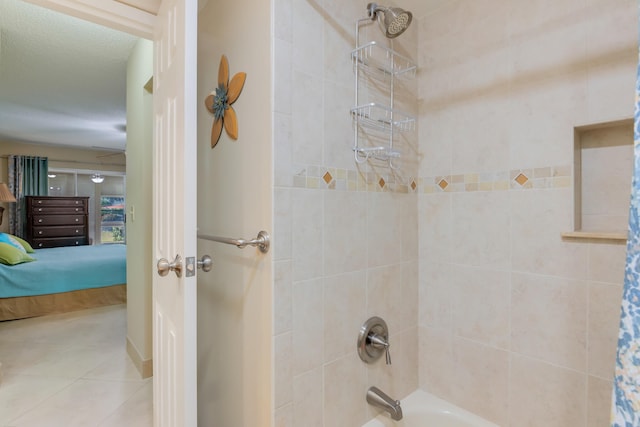 bathroom with tile patterned floors and shower / bathtub combination with curtain