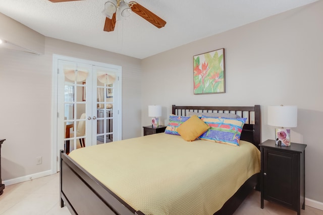 bedroom featuring french doors, a textured ceiling, and ceiling fan