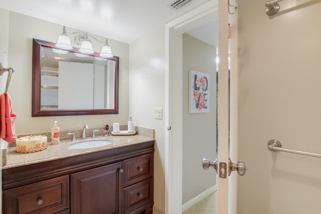 bathroom with tile patterned flooring and vanity