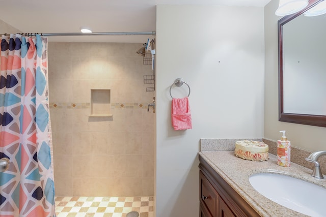 bathroom featuring curtained shower and vanity