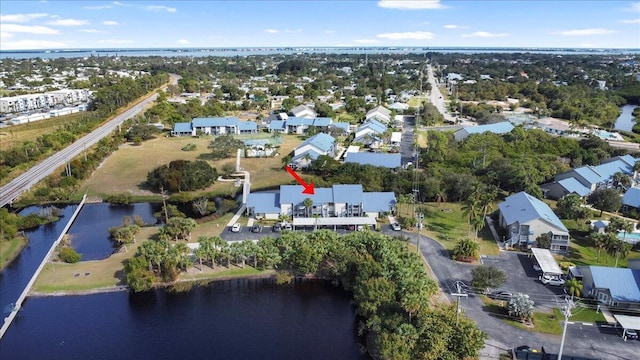 birds eye view of property featuring a residential view and a water view