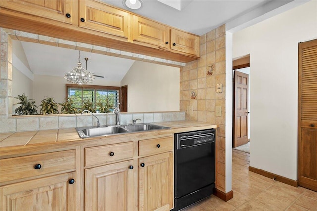 kitchen with lofted ceiling, light brown cabinets, a sink, tile counters, and dishwasher