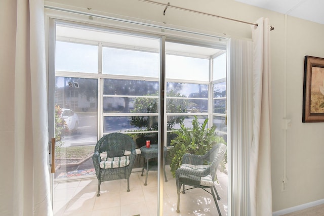 interior space featuring a healthy amount of sunlight and light tile patterned floors