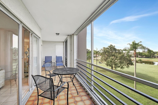 balcony featuring a water view