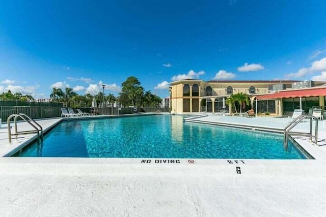 view of pool featuring a patio area