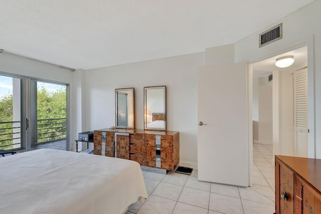 tiled bedroom with access to outside