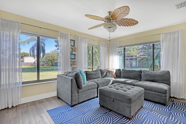 living room with ceiling fan and hardwood / wood-style floors