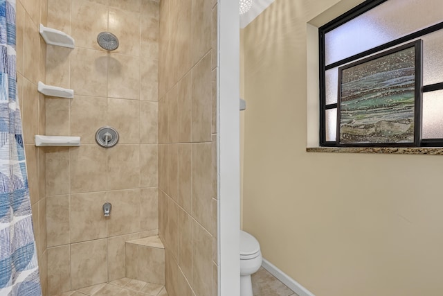 bathroom featuring toilet and walk in shower