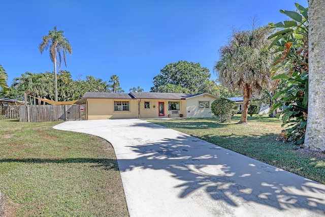 single story home with a front lawn