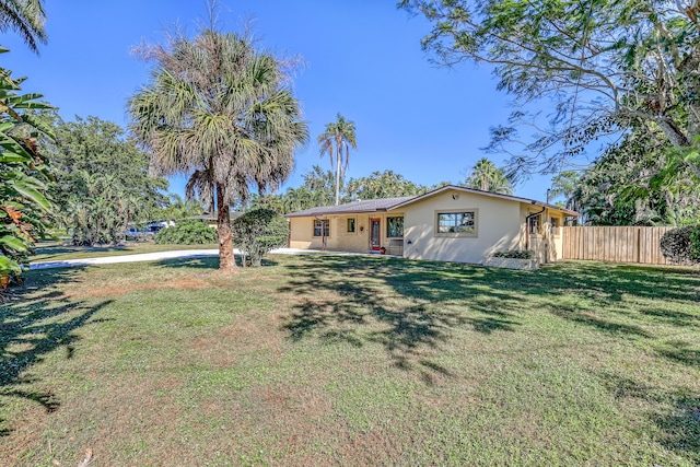 ranch-style house with a front lawn