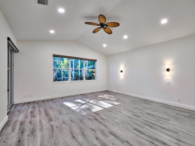 interior space featuring ceiling fan, light hardwood / wood-style flooring, and lofted ceiling