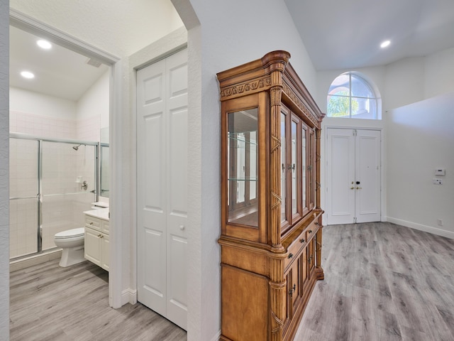 foyer entrance with light wood-type flooring