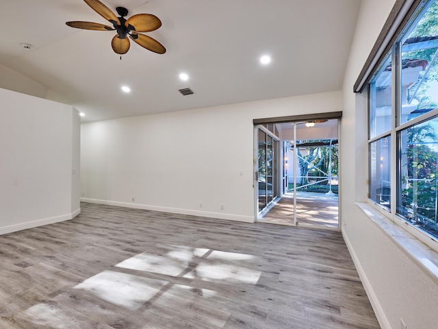 spare room with ceiling fan and light hardwood / wood-style floors