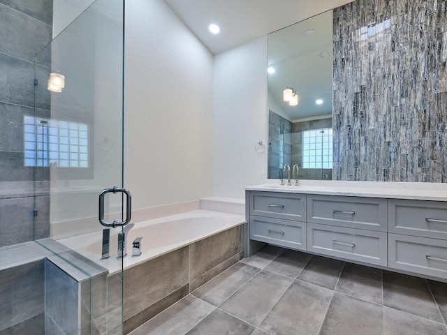 bathroom with separate shower and tub and vanity