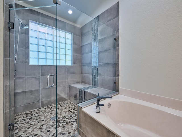 bathroom with separate shower and tub