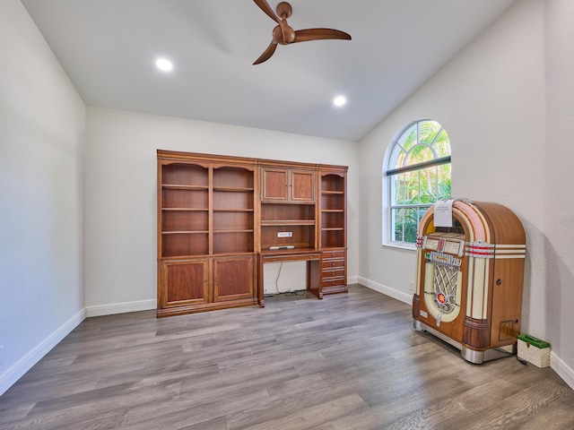 miscellaneous room featuring hardwood / wood-style floors, ceiling fan, and lofted ceiling