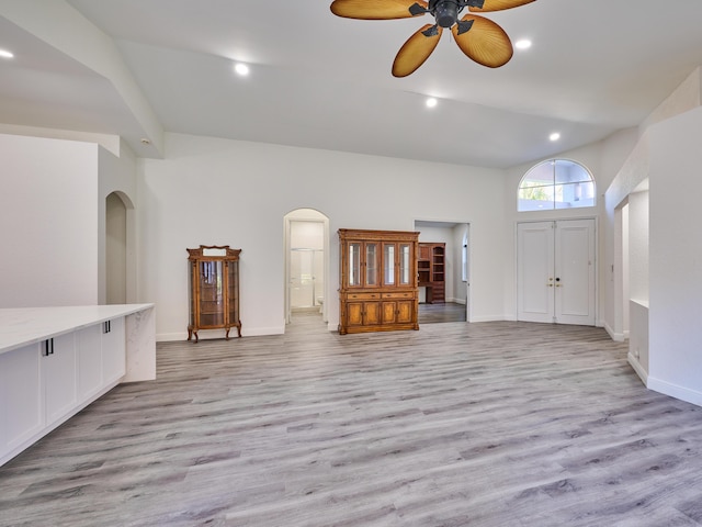 unfurnished living room with ceiling fan and light hardwood / wood-style floors