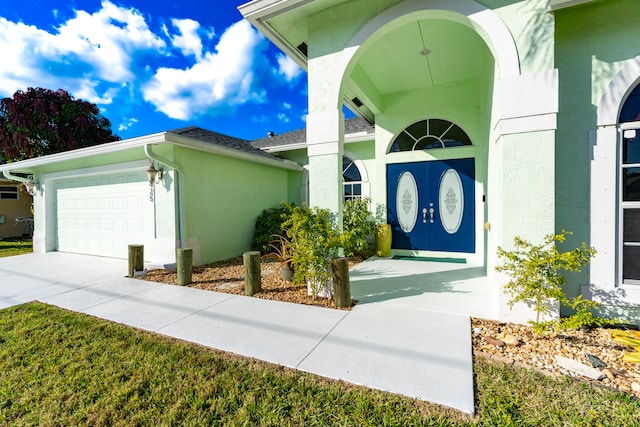 view of exterior entry featuring a garage