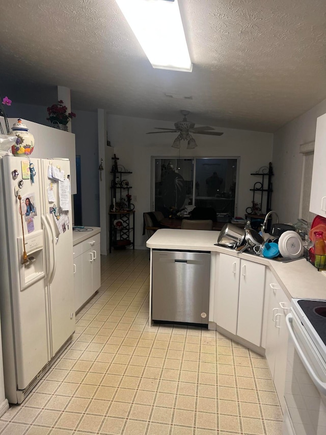 kitchen featuring white cabinets, a textured ceiling, white appliances, and ceiling fan