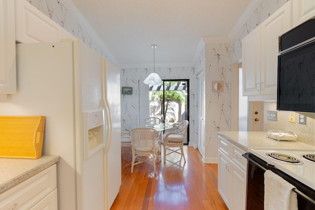 kitchen featuring white fridge with ice dispenser, light hardwood / wood-style floors, decorative light fixtures, white cabinets, and ornamental molding